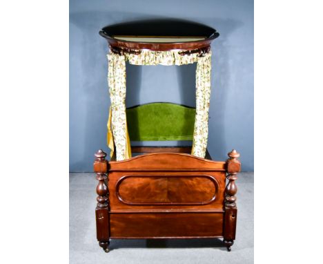 A Victorian 4ft 6ins Mahogany Half-Tester Bedstead, with curved canopy, arched and panelled footboard with baluster turned po