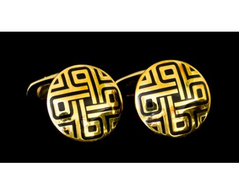 A Pair of 18ct Gold Cufflinks by Garrard, the circular faces with enamelled geometric patterns, total gross weight 17.3g