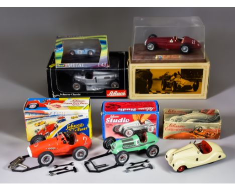 A Schuco (Germany) Examino 4001 Tin Plate Clockwork Gear Changing Car, in cream, with original windscreen, with original box 