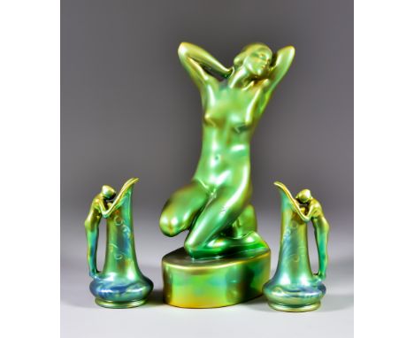 Zsolnay, Hungary, 20th Century, three pieces of Eosin green gold lustre, comprising: - a pair of Art Nouveau style nude femal