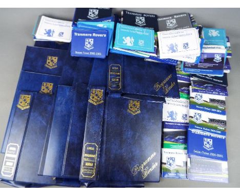 Tranmere Rovers Football Items. A box containing twelve empty official programme binders sold with approx 50 season ticket bo