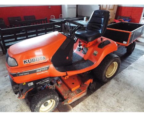 A Kubota G2160 diesel engine ride on lawnmower / tractor with trailer, the vendor advises that the mower has been serviced re