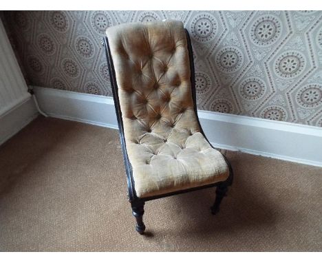 A vintage button back nursing chair.