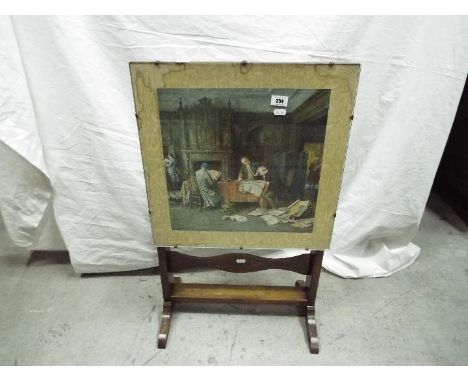 A small fold top table / fire screen having print to the top.