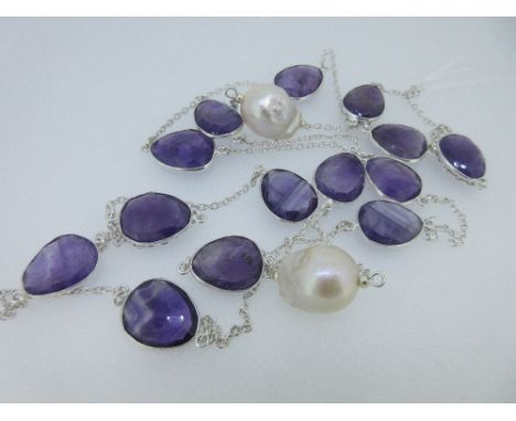 An amethyst and cultured baroque pearl necklace together with a pair of amethyst earpendants, the necklace composed of fourte