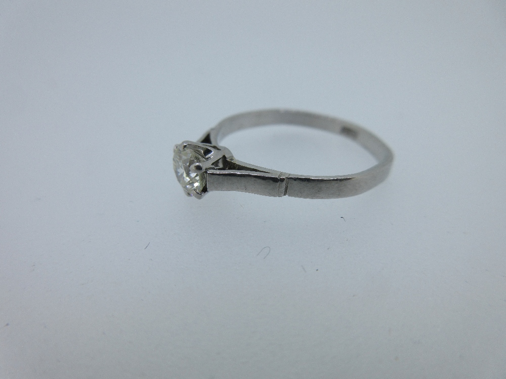 A single stone diamond ring, the round brilliant cut diamond, estimated ...