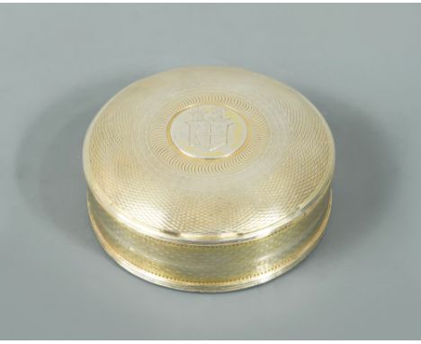 A George III silver gilt snuff box, maker unknown, Chester 1815, of circular form, engine turned all over, with slightly dome