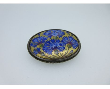 A Continental mid 20th century hand-enamelled brooch depicting cornflowers, the horizontal oval filled with realistically pai