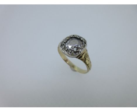 A Georgian diamond cluster ring, the central cushion cut diamond in a border of rose cut diamonds, and a closed back and quat