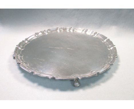 A George V silver salver, by William Hutton &amp; Sons, Sheffield 1930, 'Chippendale' style, raised on four scroll feet, stam