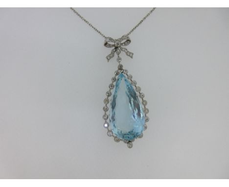 A Belle Époque diamond and aquamarine pendant necklace, the pear shaped facetted aquamarine estimated to weigh in excess of 4