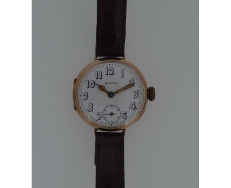 Rolex - A 9ct gold WW1 officer's 'Trench' wristwatch, circa 1916, the signed circular white dial, 30mm diameter, with Arabic 