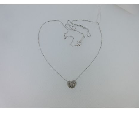 A diamond set heart shaped pendant and chain, the slightly domed heart pavé set with numerous small round brilliant cut diamo