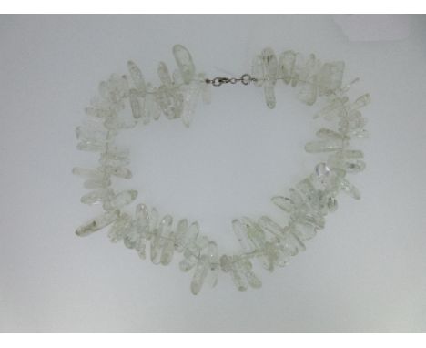An abstract rock crystal nugget necklace, composed of variously sized and nominally rectangular shaped polished rock crystal 