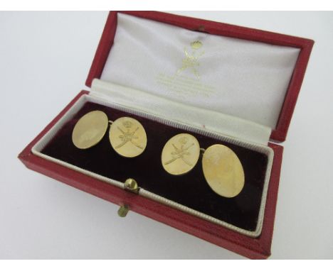 A pair of 9ct gold double-ended cufflinks cased by Asprey, each with plain oval flat plaques and chain connections, the 'fron