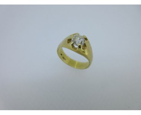 A single stone diamond ring, the claw set 'old' cut diamond of approximately 1.10ct with scalloped gallery to flared shoulder