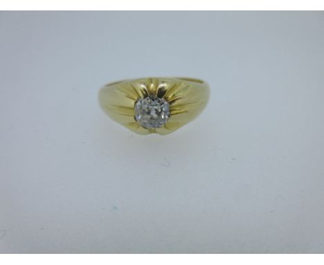 A single stone old cut diamond ring, the plain shank swelling at the front and cast into a sunburst of raised rays, the tips 