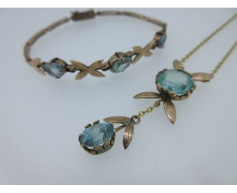 A mid 20th century blue zircon and light blue spinel pendant necklace and bracelet suite, the necklace with two pairs of leav