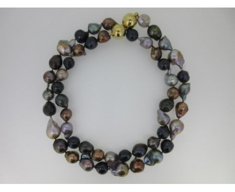 A large baroque pearl necklace of subtle earth-colour hues, the variously shaped and gently graduated large (13-23mm) pearls 