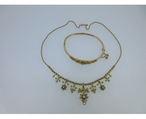 A seed pearl fringe necklace and matched hinged bangle, the necklace front composed of a line of seed pearls from which are s