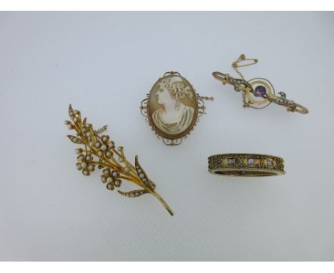 A vintage diamond set scarf pin and three brooches, the scarf pin of uniform width, set to the front with three round old cut