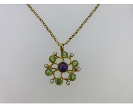 A Suffragette colour brooch / pendant with chain, designed as an open Catherine wheel with central round facetted amethyst wi