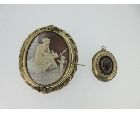 A Victorian garnet cabochon pendant and a similar period cameo brooch with classical scene, the oval pendant of low boss form