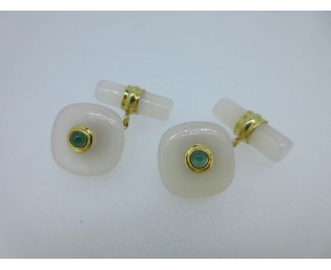 A pair of chalcedony and emerald cufflinks, each with one end designed as a cushion shape of white chalcedony with a central 