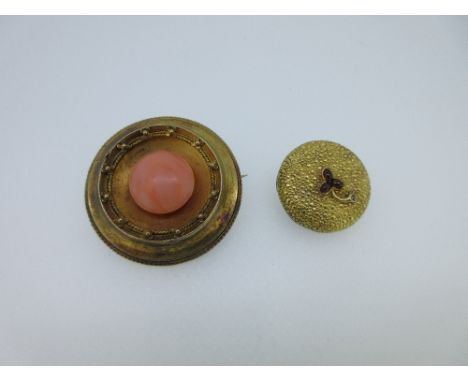 Two circular Victorian gem set brooches - one coral, one with a garnet and diamond flower, the first of raised and dished for