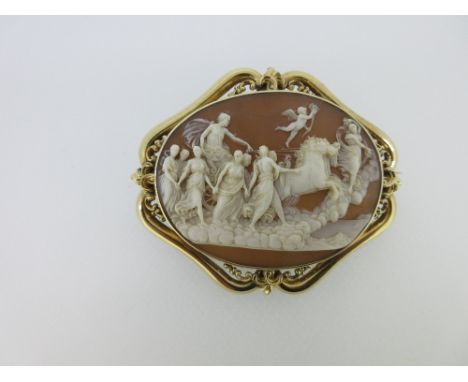 A Victorian cameo brooch depicting Helios chasing the dawn, the shell cameo finely and deeply carved and representing the Gre