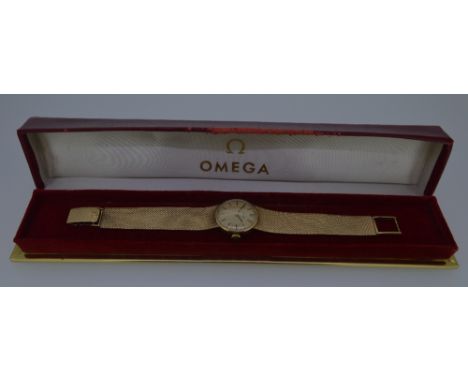 Omega - A lady's 9ct gold wristwatch, circa 1969, the circular signed champagne dial, 20mm diameter, with black baton markers