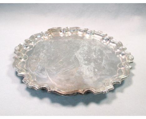 An Edward VII silver salver, by James Deakin &amp; Sons, Sheffield 1905, 'Chippendale' style with shell accents, raised on th