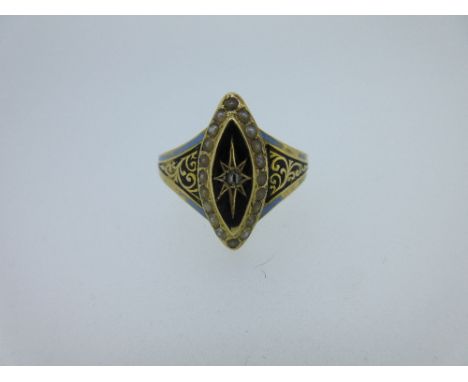 An 18ct gold mid Victorian navette shaped mourning ring, with a vertical elongated star set rose cut diamond on a black ename