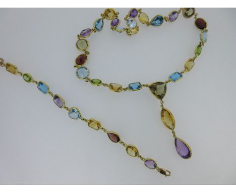 A multi gem set statement necklace and bracelet en suite, composed of graduating facetted amethyst, citrine and golden quartz