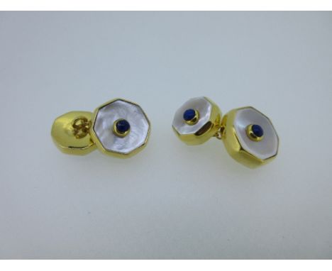 A pair of mother-of-pearl and lapis lazuli double-ended cufflinks, each with a larger and a smaller octagonal end formed by a
