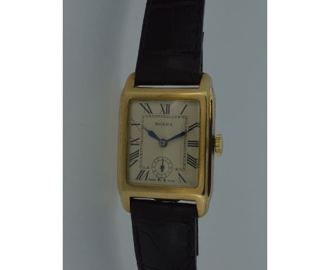 Rolex - A 9ct gold gentleman's wristwatch, circa 1930, the signed rectangular parchment coloured dial with black Roman numera