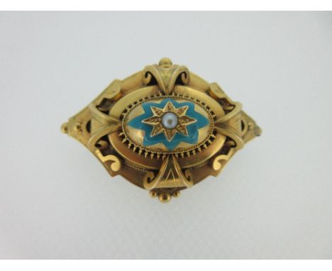 A Victorian turquoise enamel and seed pearl brooch, of diaper outline, with a central oval boss set with a seed pearl in a st