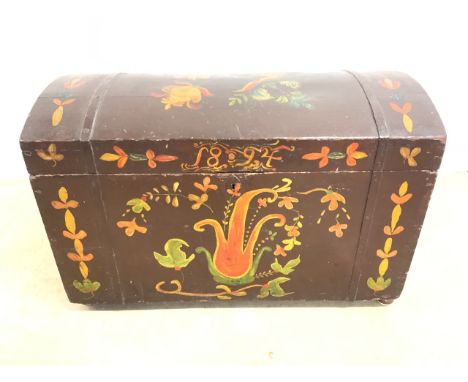 A Dome topped handpainted trunk dated 1894, naively painted with metal handles to the sides. W:78cm x D:41cm x H:50cm