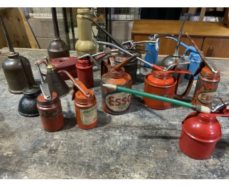 A collection of eighteen vintage oil cans. Esso, Groz, Halfords and others. 