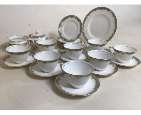 Royal Worcester part tea set in Devonshire design includes 8 cups and saucers, sugar bowl with cover, jug, 8 tea plates and a