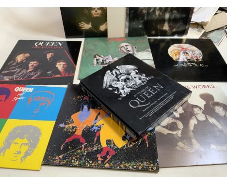 Queen vinyl records also with a Queen box set book, The Day at the races, the game, Greatest hits, hot space, the works, a ki