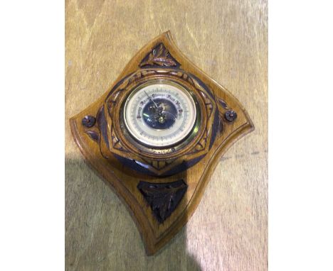 An early 20C barometer in pretty hand carved mountW:37cm x H:29cm