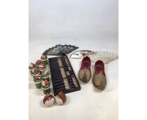 A pair of Turkish slippers, fans an abacus and Japanese spice shakers and others