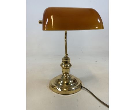 A Modern library style lamp with amber coloured shade. H:37cm