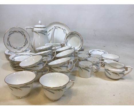 A Royal Worcester Harvest Ring tea and coffee set comprising tea cups and saucers, coffee cups and saucers, tea plates, a cak