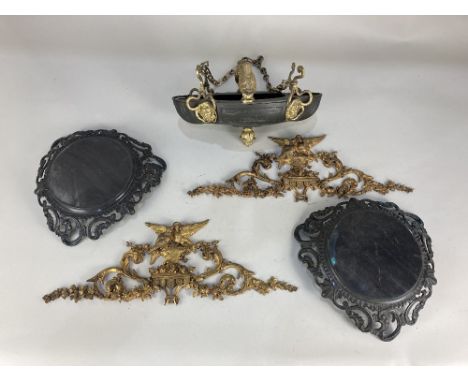 A pair of gilt metal furniture mounts, cast as two birds on an urn within floral scrolls, 44cm by 15cm, together with a brass
