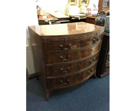 A late George III inlaid mahogany bow front chest of four graduated drawers, with brushing slide, on shaped bracket feet, 91.