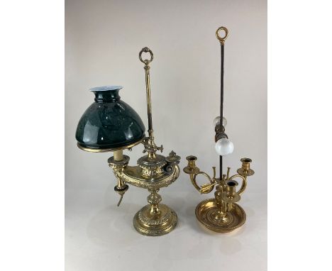 A brass oil adjustable table lamp, converted to electric, of Alladins lamp form, with green glass shade, 55cm high, together 