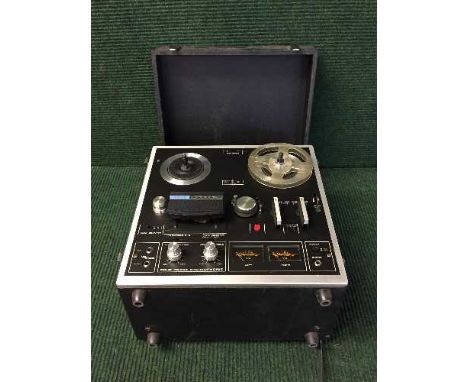 Two boxes of reel to reel player, Toshiba dvd player, digital camera, books, antique references, cds etc.