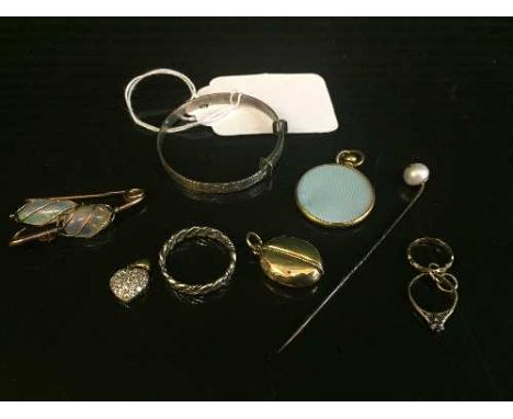 A collection of eight items of jewellery including silver baby's bangle, white metal ring, Edwardian locket, two gilt metal r